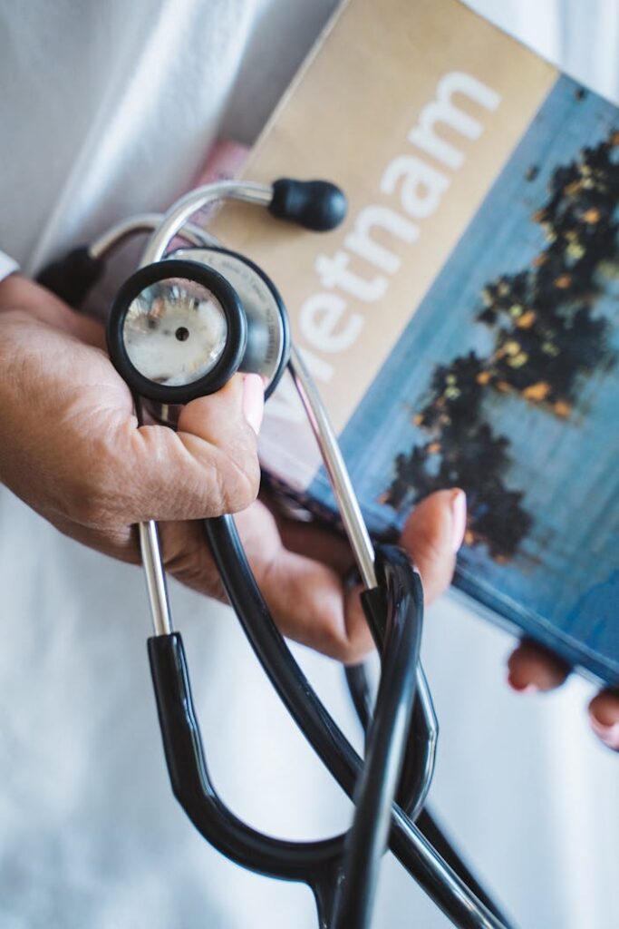 Black and Silver Stethoscope on a Person's Hand